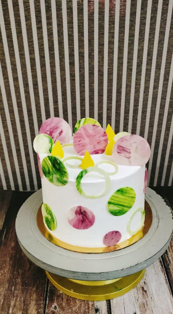 Multi-tier cake with gold accents for weddings and events in Hyderabad